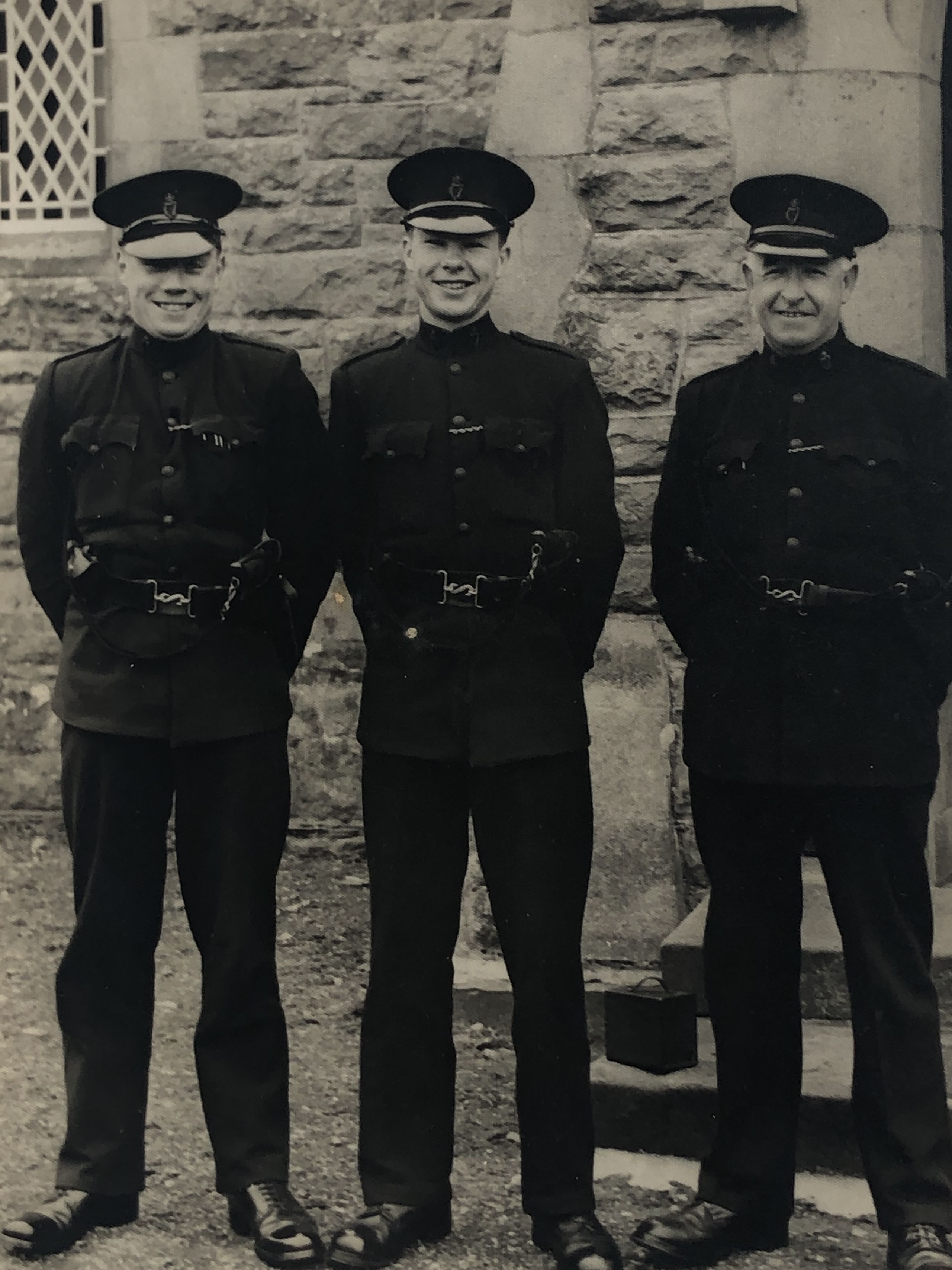Gordon Knowles (left) with fellow officers.