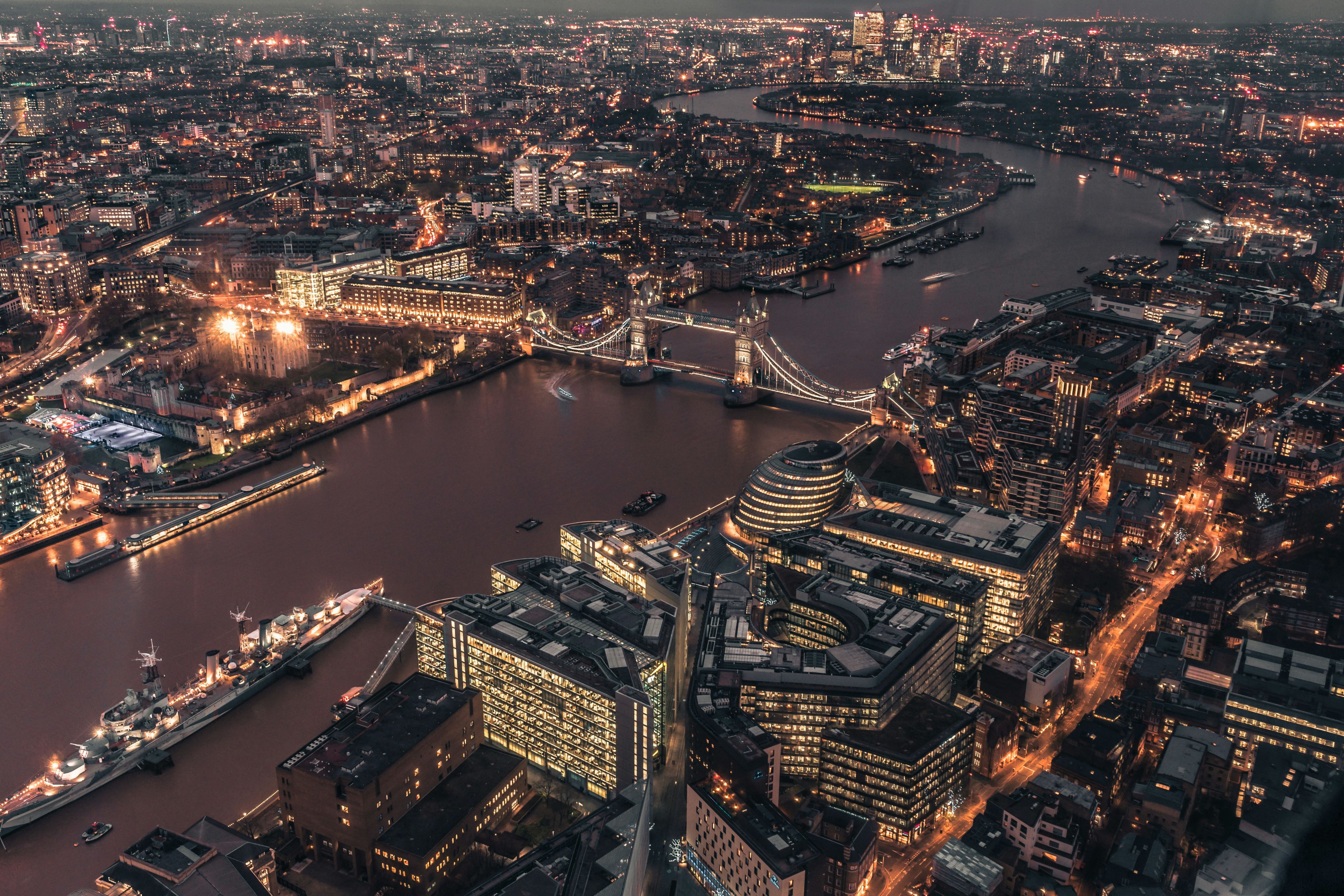 Aerial shot of a city at night with river