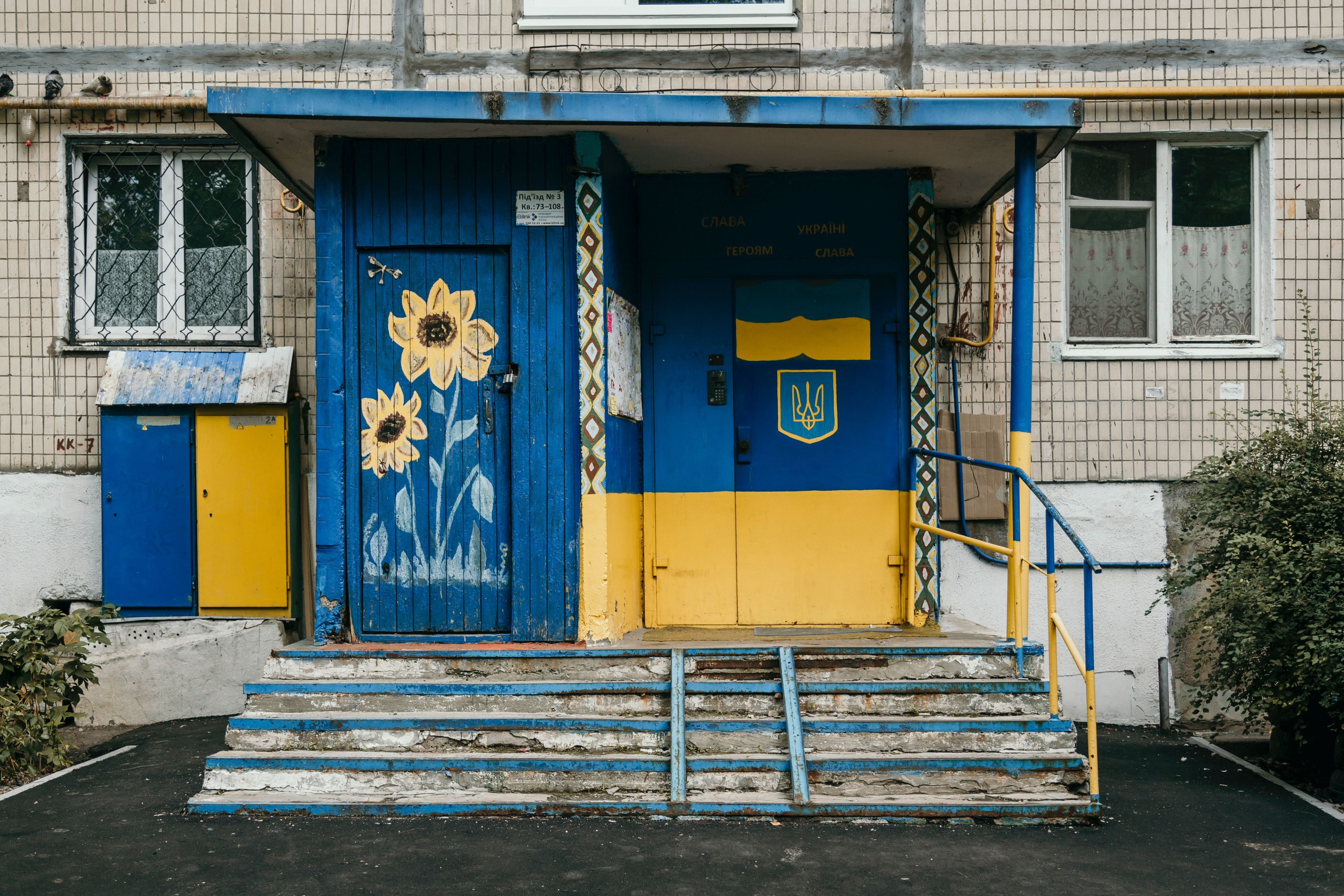 Image of front of building painted in Ukrainian flag colours