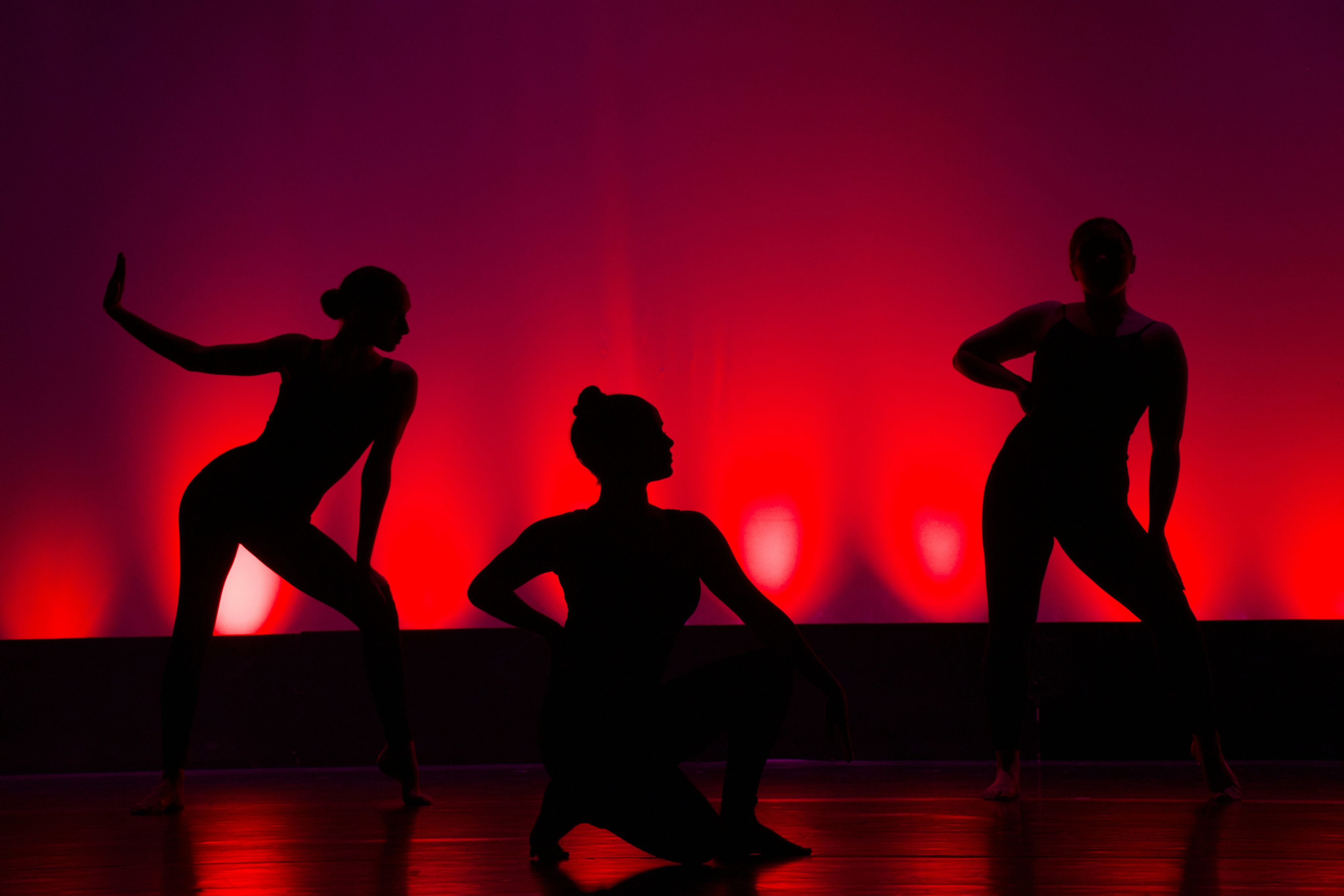 silhouette of people dancing