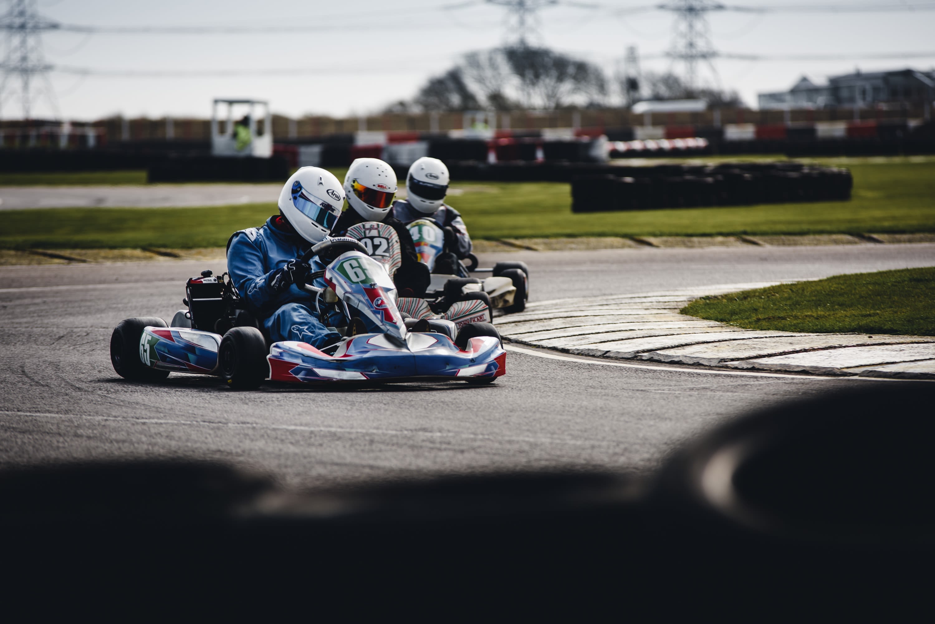 three person racing in go-kart