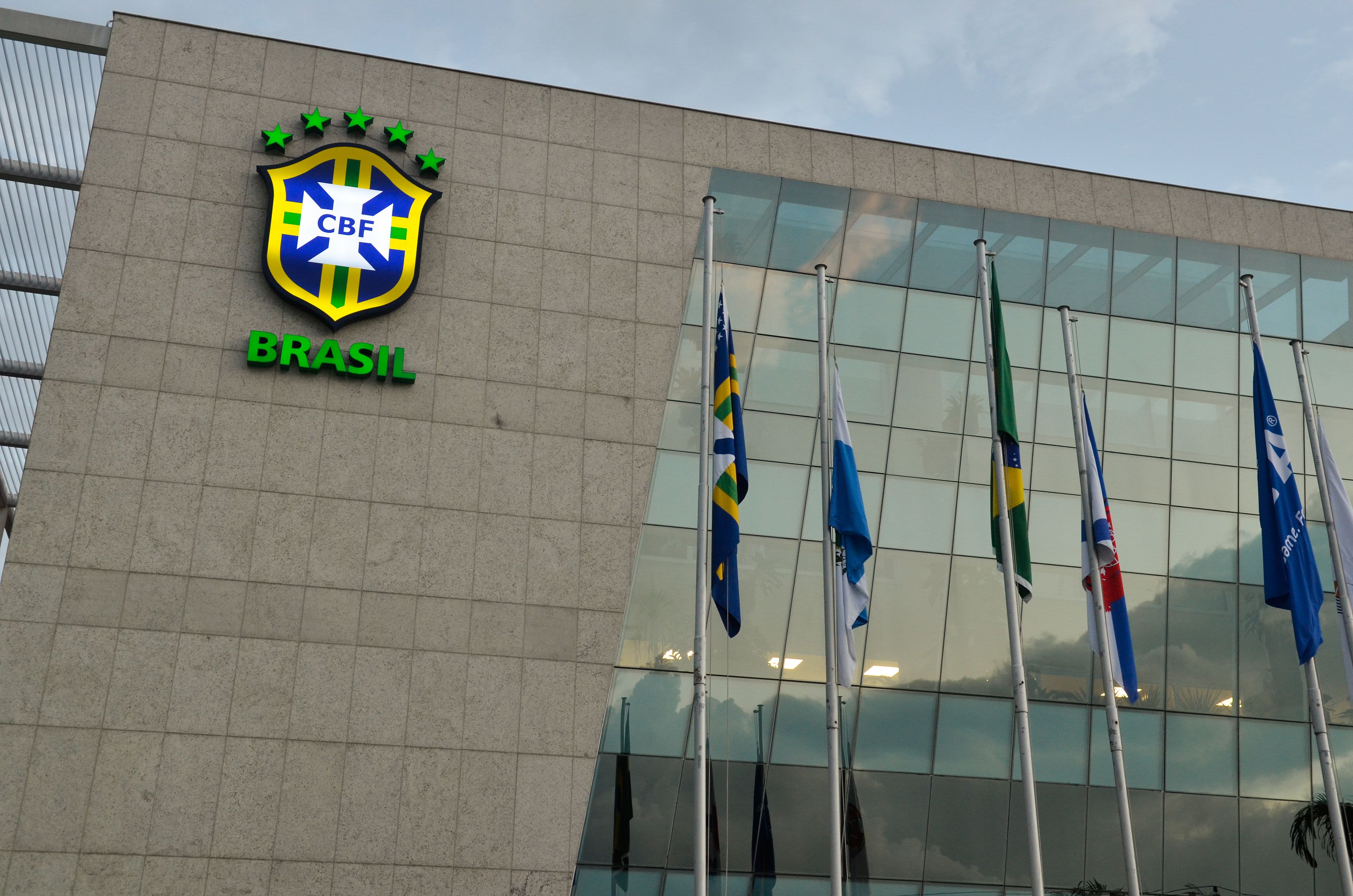 Brazil yellow and blue CBF logo in top left of building of headquarters