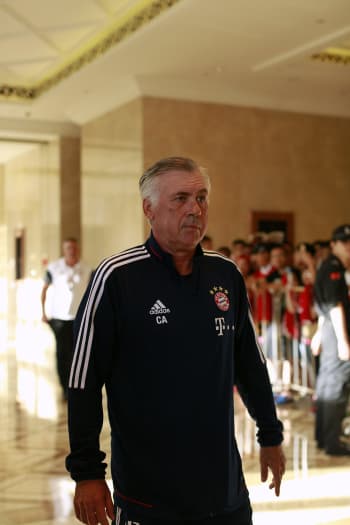 Carlo Ancelotti arriving in Asia in a Bayern Munich tracksuit top