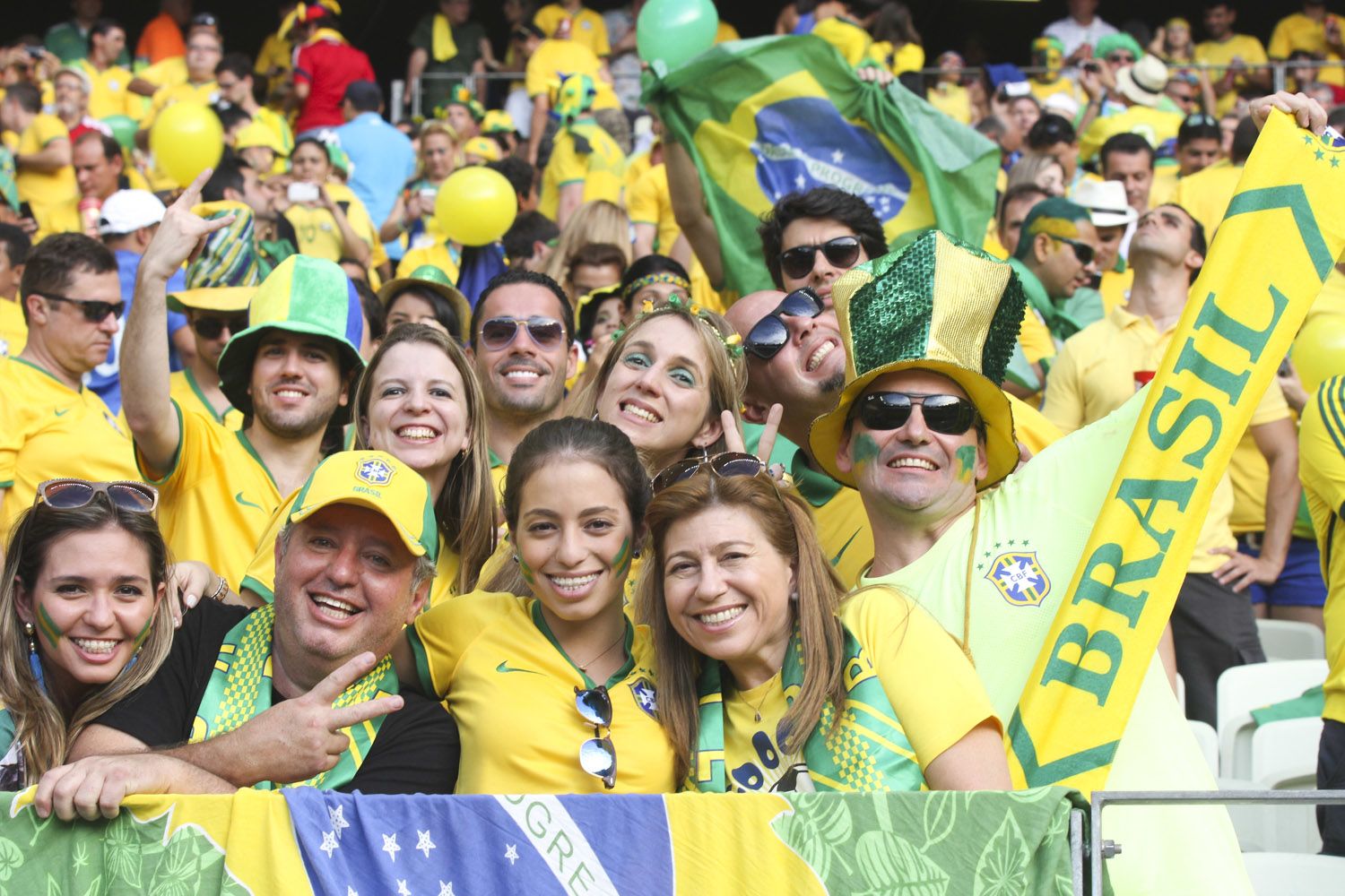 Brazilian fans wearing yellow and green at the 2014 World Cup