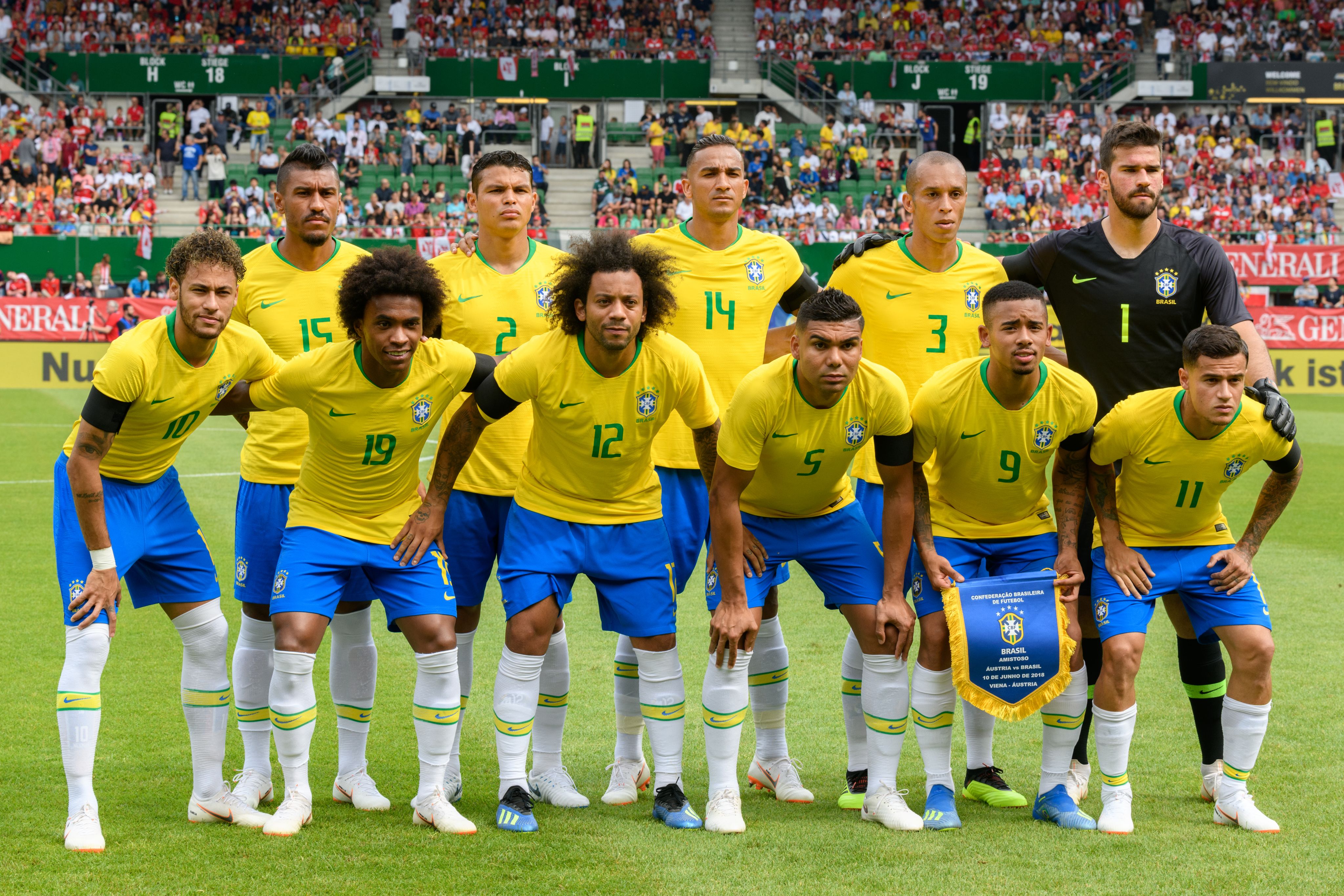 Brazilian national team lining up in yellow shirt in 2018 friendly game inlcuding Neymar on the left, followed by Paulinho, Willian, Thiago Silva, Marcelo, Danilo, Casemiro, Miranda and Gabriel Jesus with players posing for before match photo