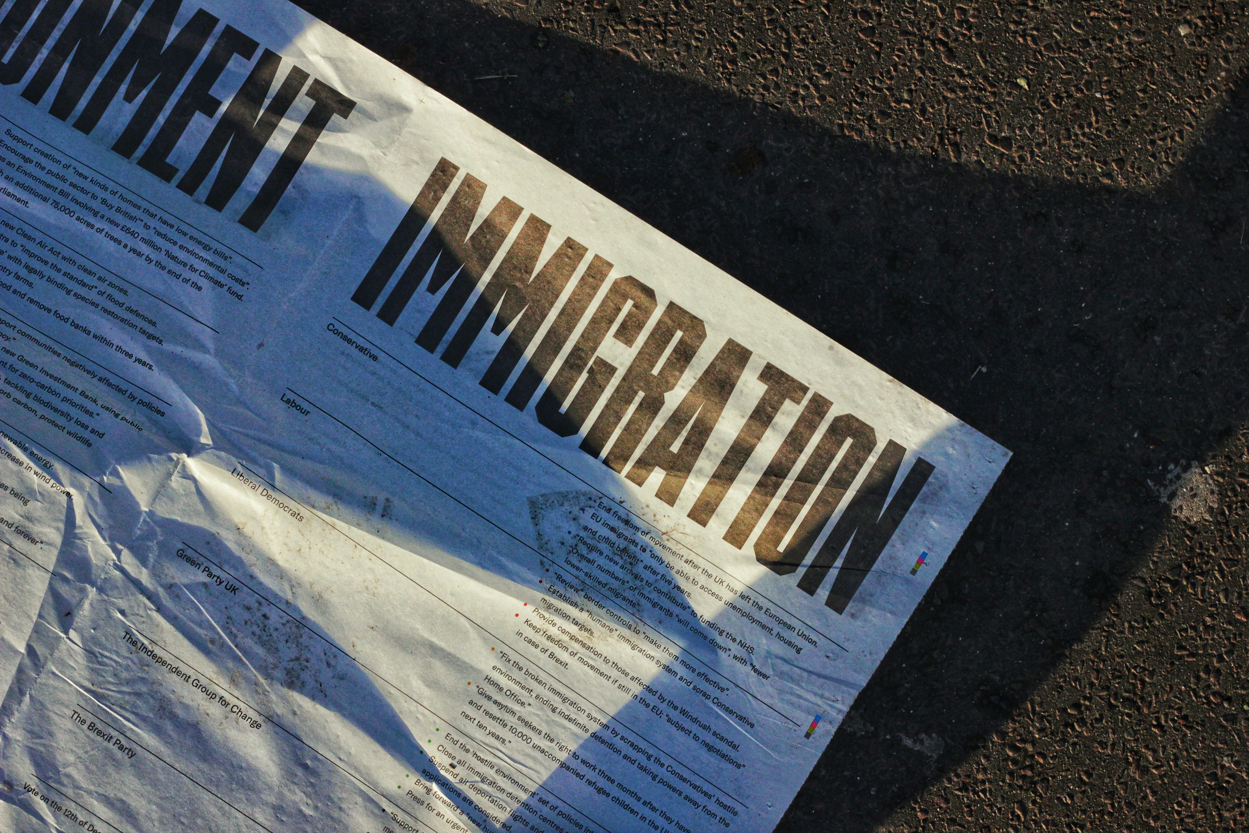 A white leaflet that has the word 'immigration' written in capital letters and black print