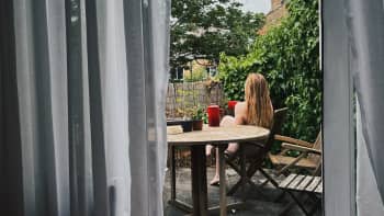 naked woman drinking coffee outdoors