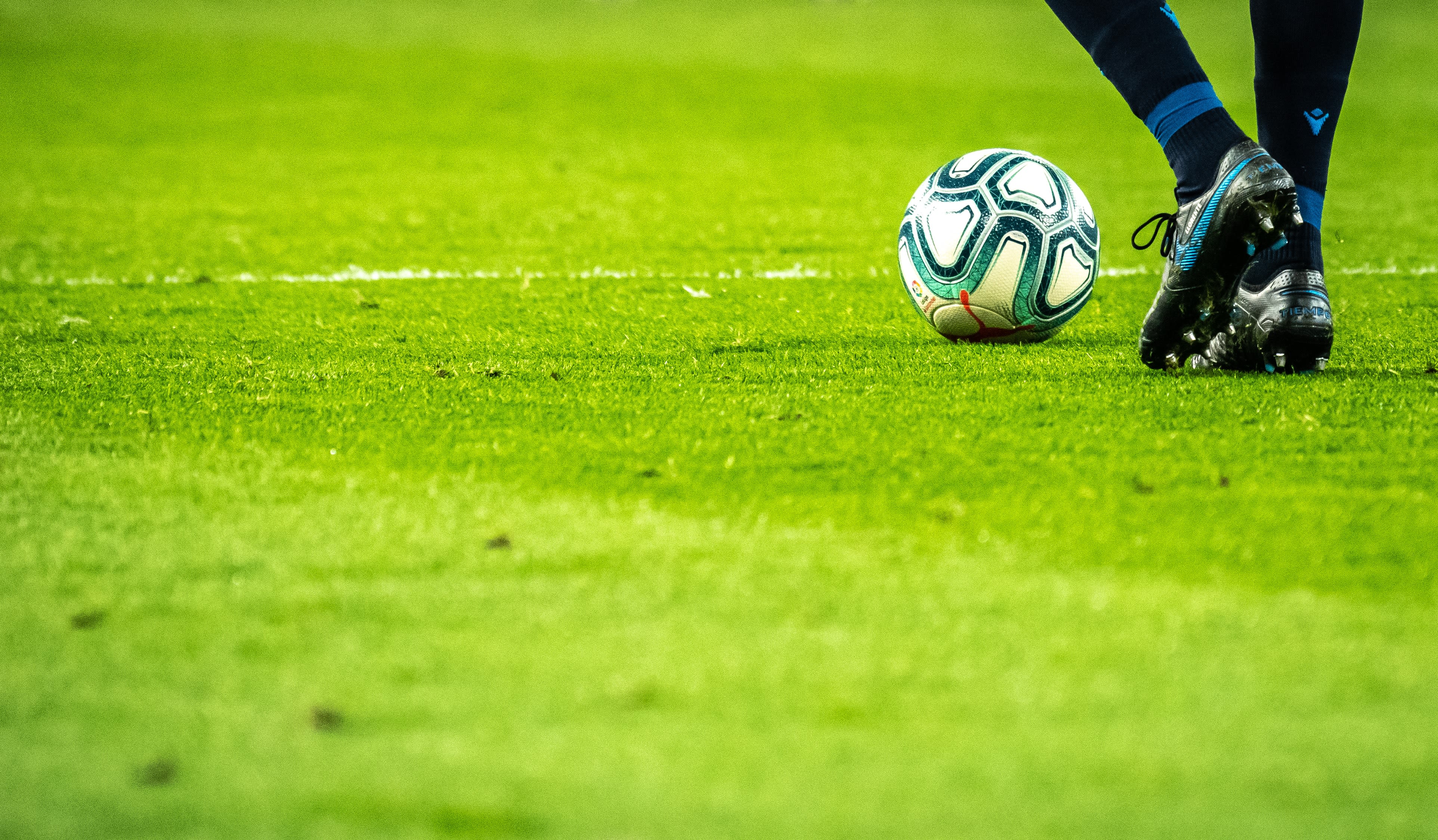 man playing soccer game on field