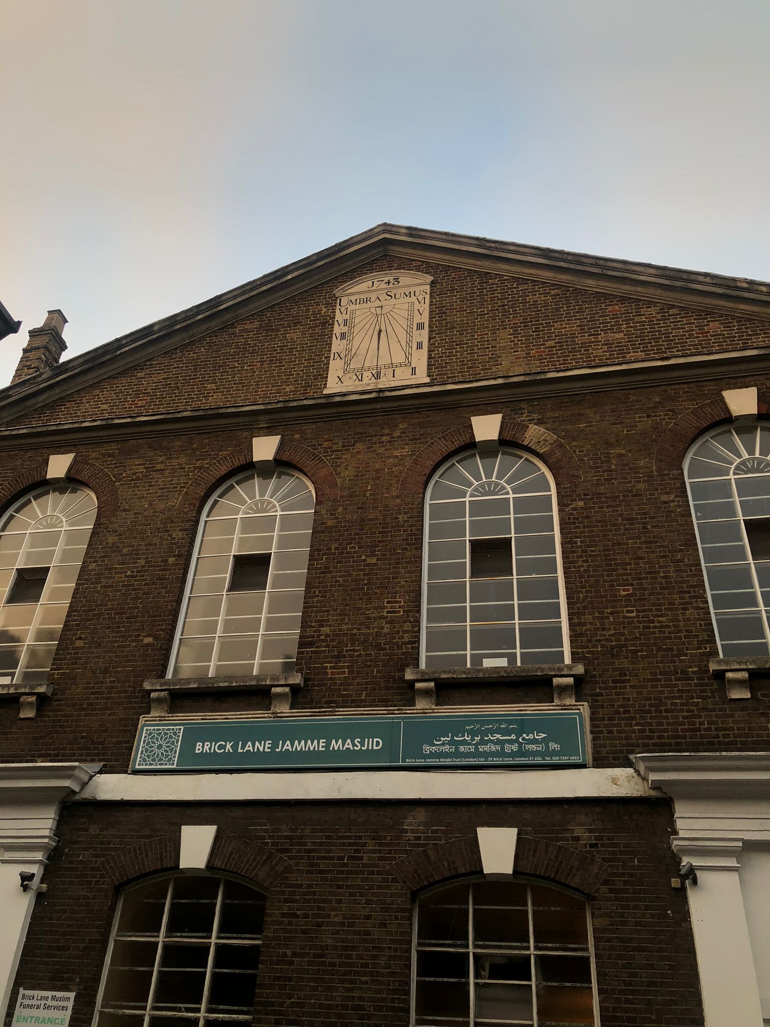 brown brick building with glass window