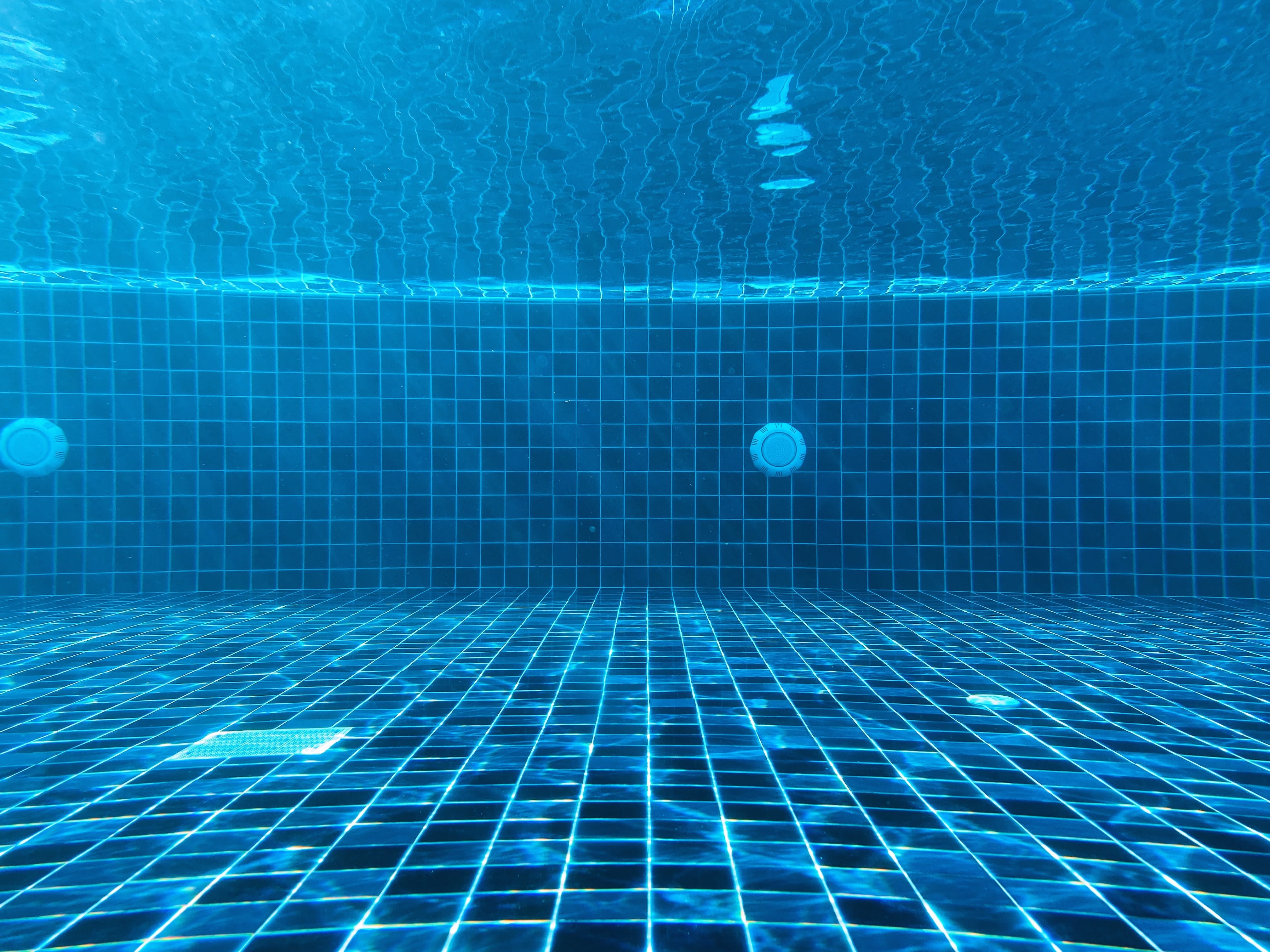blue swimming pool with water